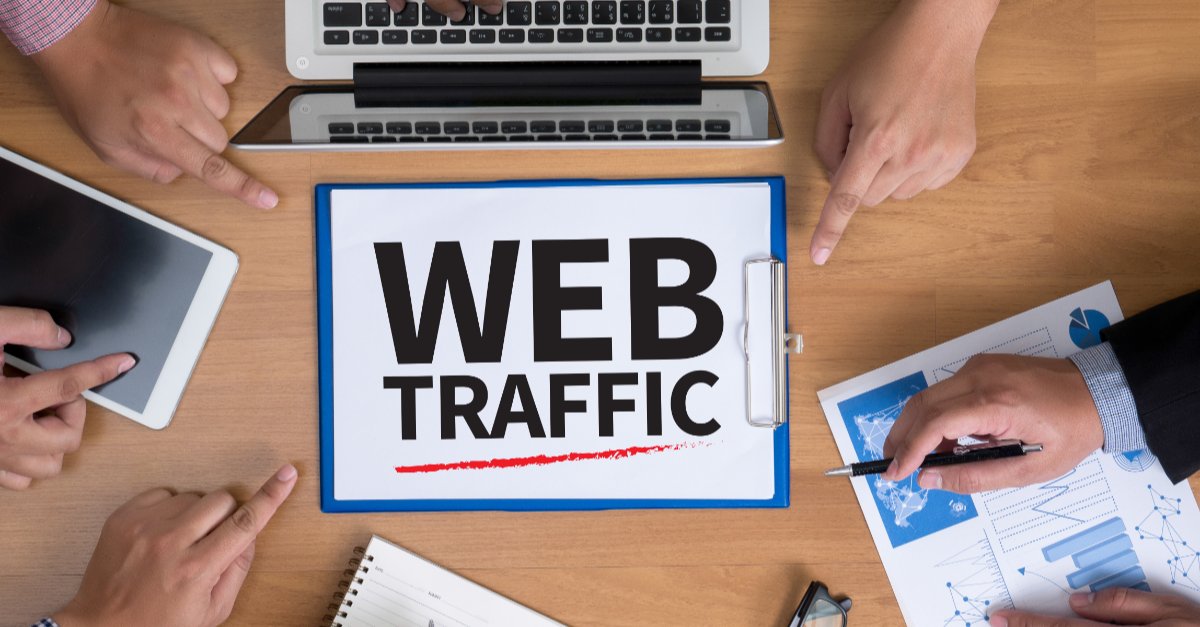 People Assessing Self Storage Website Traffic At Table